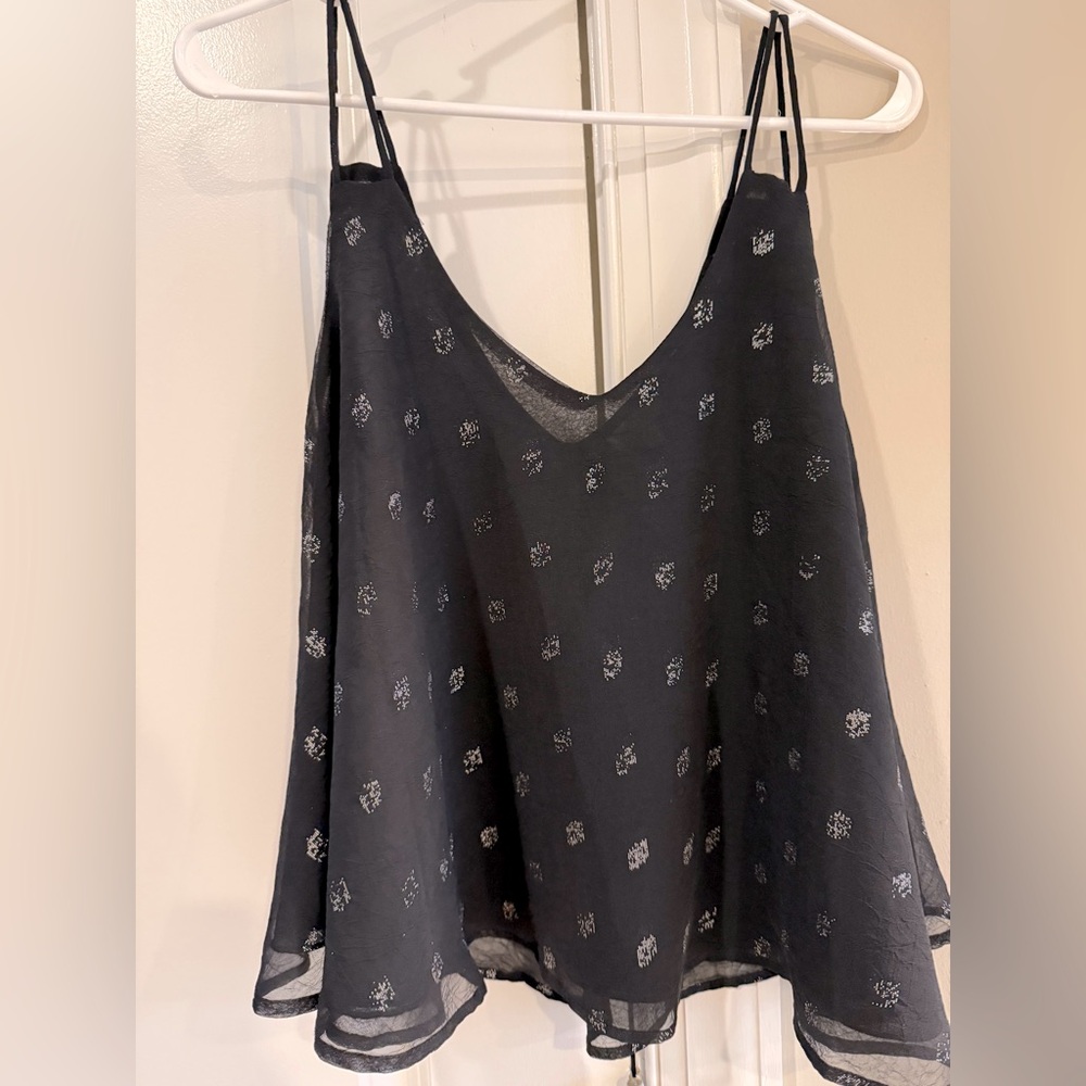 From Siuth Moon Under. Never worn. Cute flowy top.
